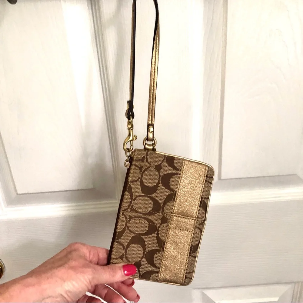 Coach signature tan wristlet, gold strap & stripe